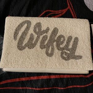 NWT Beaded clutch spells “Wifey". Comes with chain